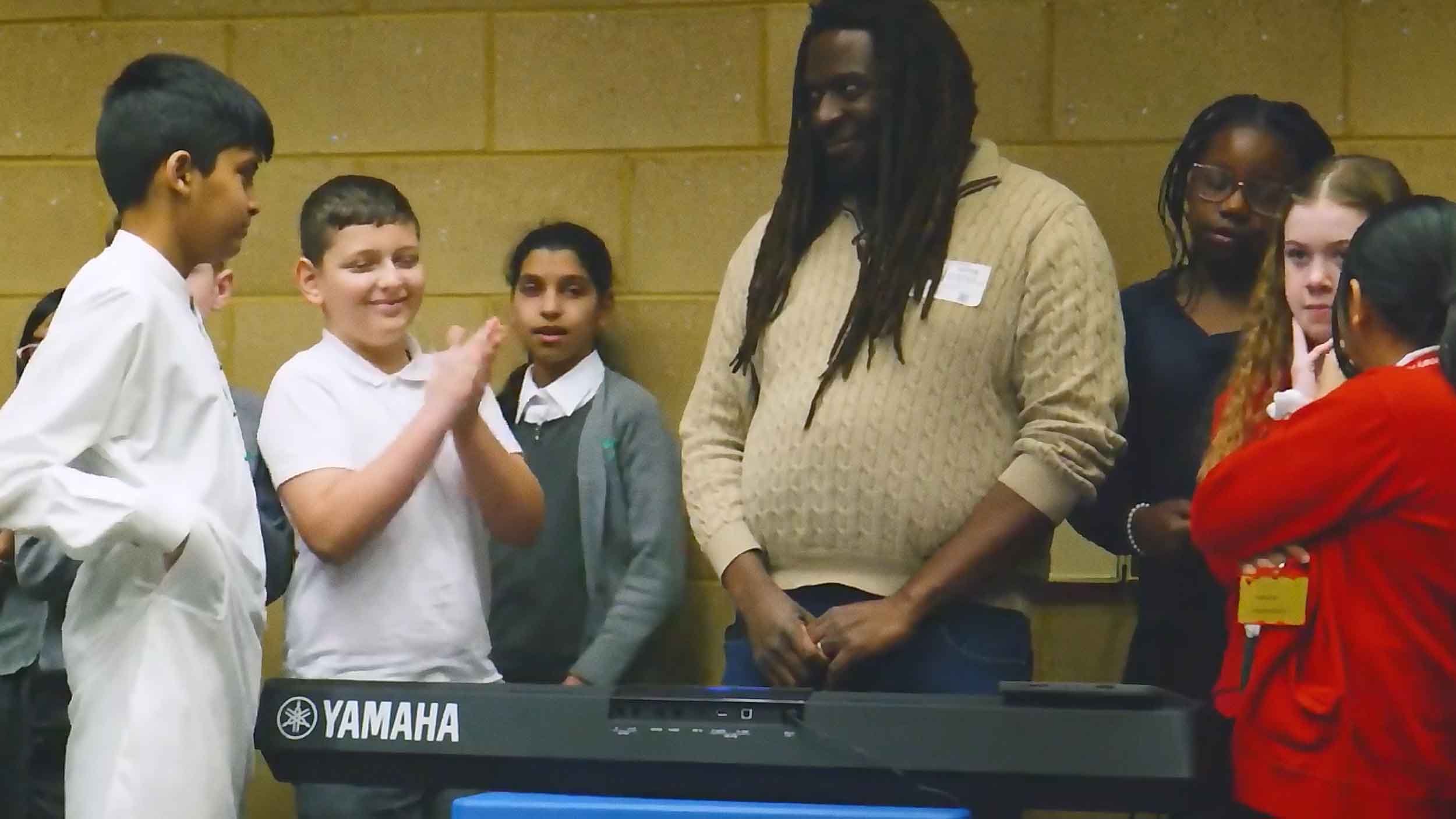 Children work on a song with composer Aga Serugo-Lugo